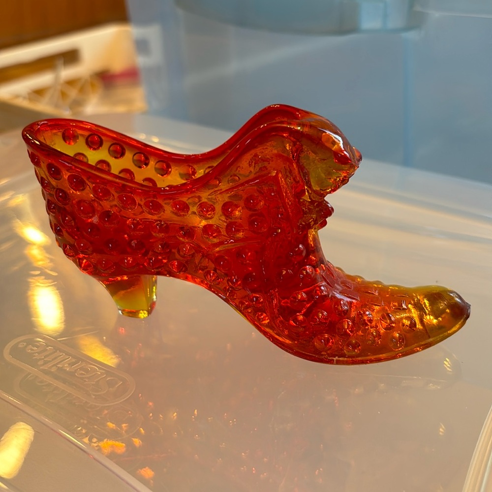Vintage orange glass high heel shoe.